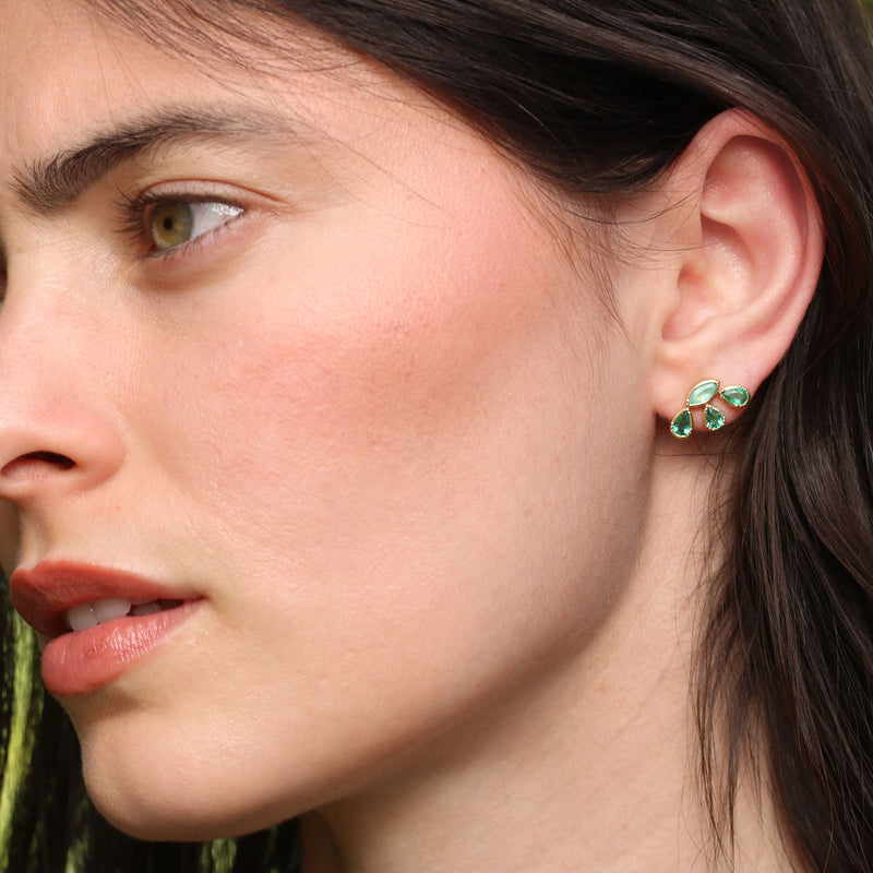 Model wearing One of a kind Parabia Tourmaline and Emerald earrings in a floral array. Fine jewelry hand made in London from Los Angeles designer Brooke Gregson.