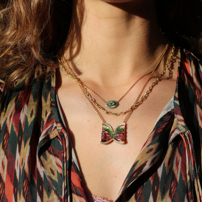 Model wearing mutliple necklaces, 18k gold one of a kind hand carved Tourmaline Butterfly necklace with White Diamond pave, fine jewelry hand made in London from Los Angeles designer Brooke Gregson