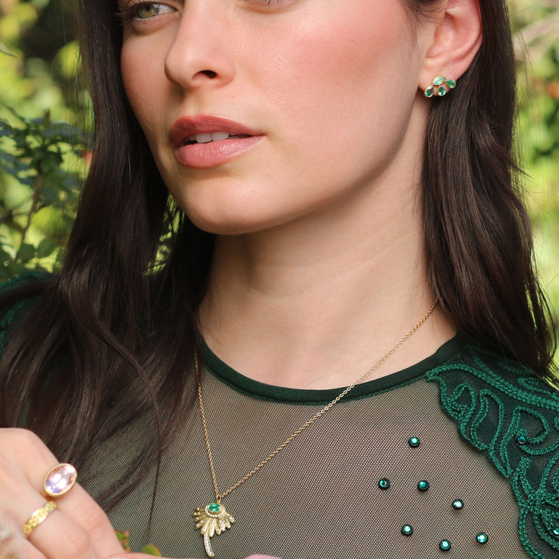 Model wearing One of a kind hand engraved Emerald daisy necklace with White Diamond pave  in 18k gold.  Fine jewelry hand made in London from Los Angeles designer Brooke Gregson.