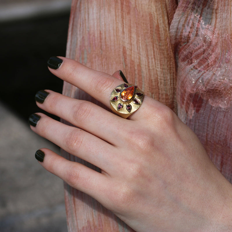 Model wearing One of a kind Sunshine Mandarin Garnet Ruby Engraved Ring fine jewelry handmade in London from Los Angeles designer Booke Gregson