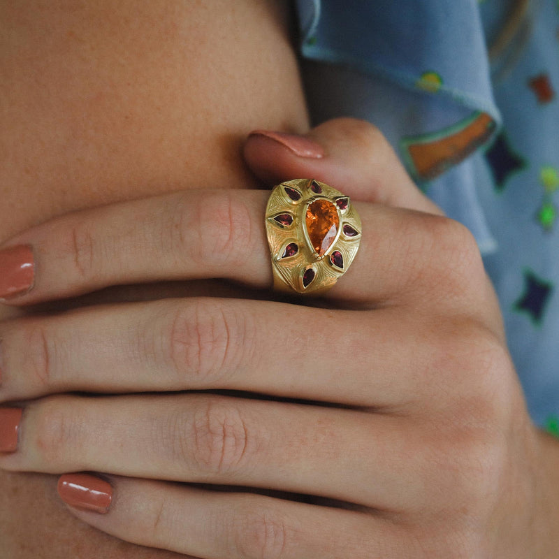 Model wearing One of a kind Sunshine Mandarin Garnet Ruby Engraved Ring fine jewelry handmade in London from Los Angeles designer Booke Gregson