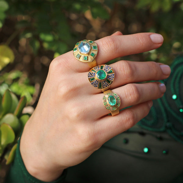 Model wearing 18k gold Aquamarine  and Emerald Rings by Los Angeles fine jewellery designer Brooke Gregson